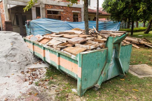 Cluttered loft being cleared by professionals in Hoxton